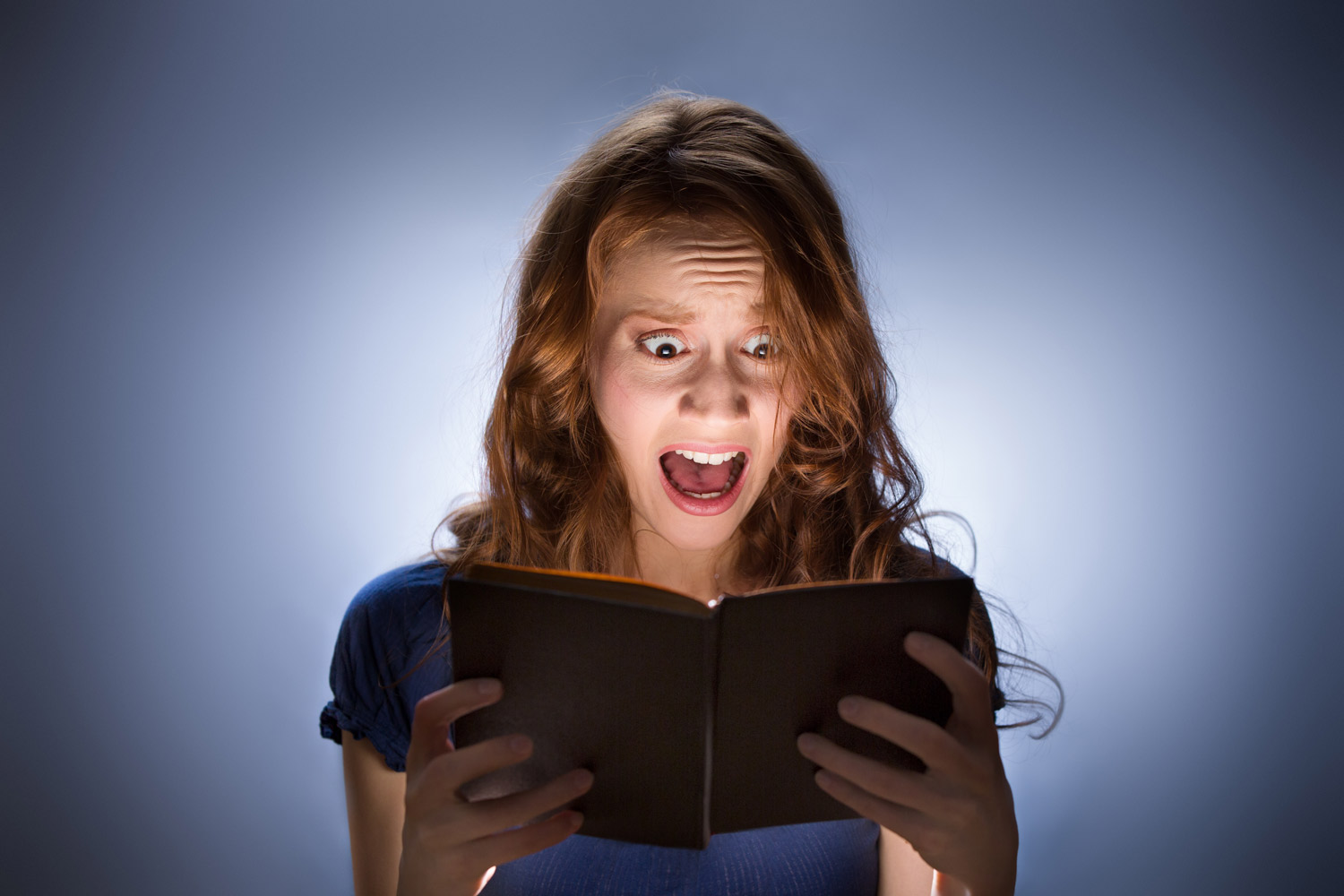 woman-reading-scary-book-datingnerdz